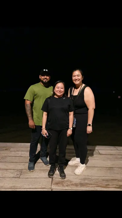 Travellers posing together at night