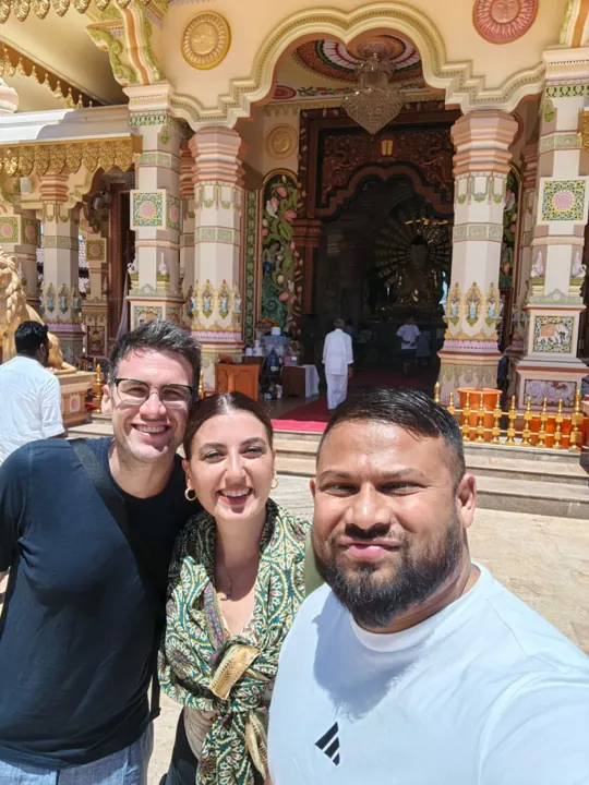 Travellers at a colourful temple entrance