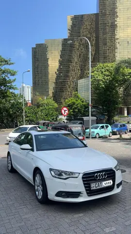 Audi A6 — white car, front and side in daylight