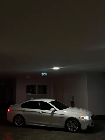 BMW 530 — white car, side under cover