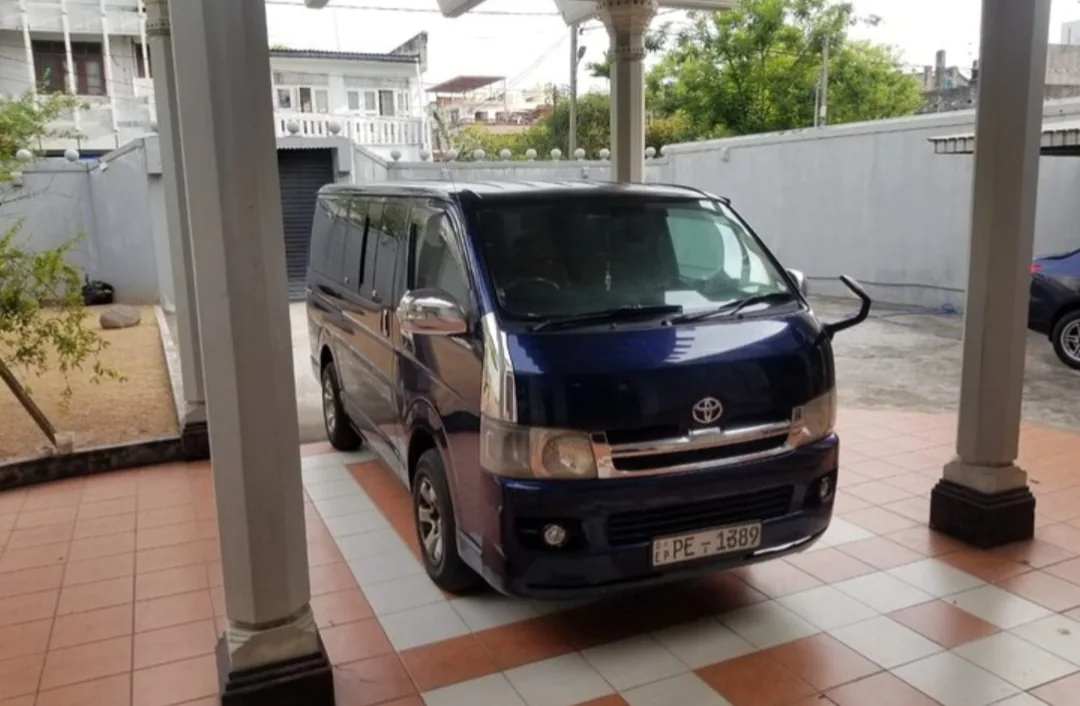 Toyota KDH Flat Roof — blue van, front and side