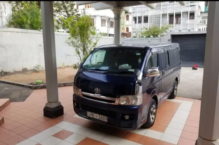 Toyota KDH Flat Roof — blue van parked under cover