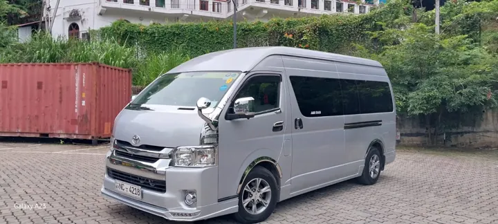 Toyota KDH High Roof — silver van, front and side