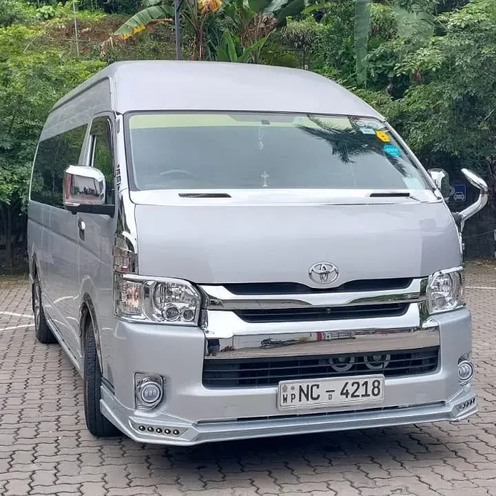 Toyota KDH High Roof — silver van, front