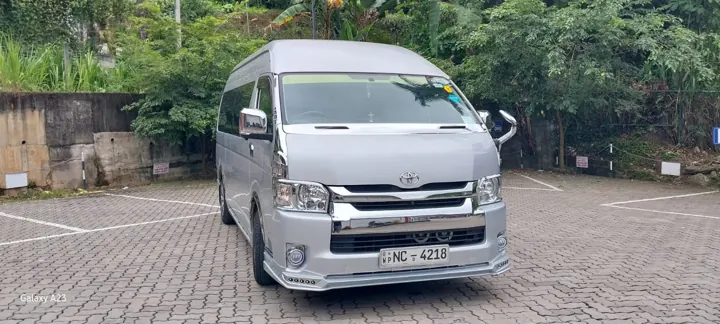 Toyota KDH High Roof — silver van, front