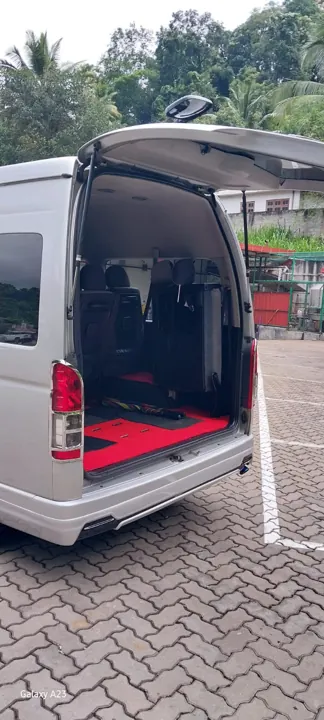 Toyota KDH High Roof — open rear of the silver van