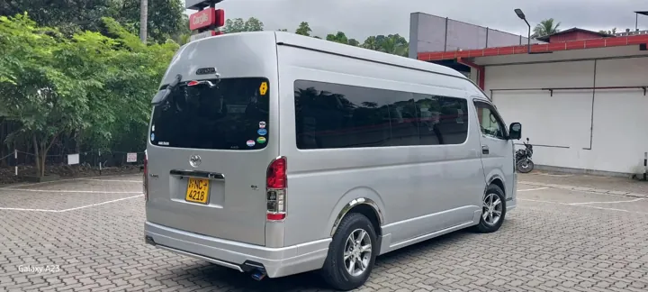 Toyota KDH High Roof — silver van, rear and side