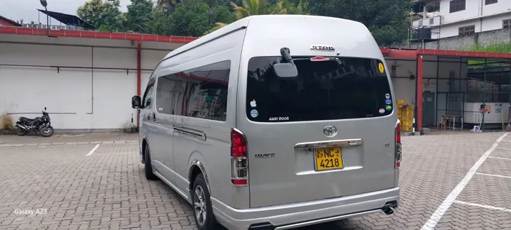 Toyota KDH High Roof — silver van, rear