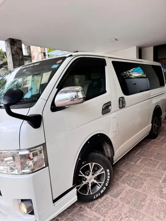 Toyota KDH (white flat roof) — white van, front and side