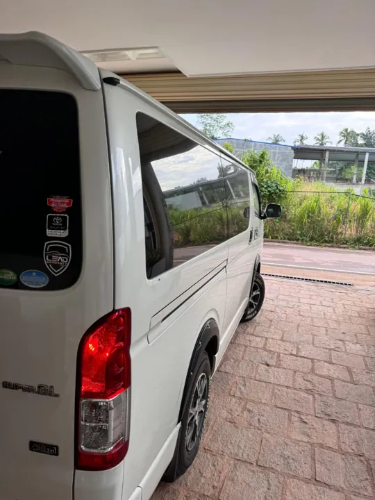 Toyota KDH (white flat roof) — white van, rear and side