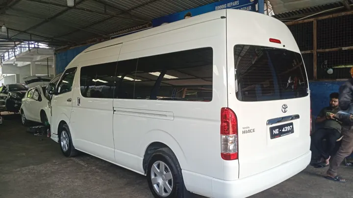 Toyota KDH (white high roof) — white van, rear and side